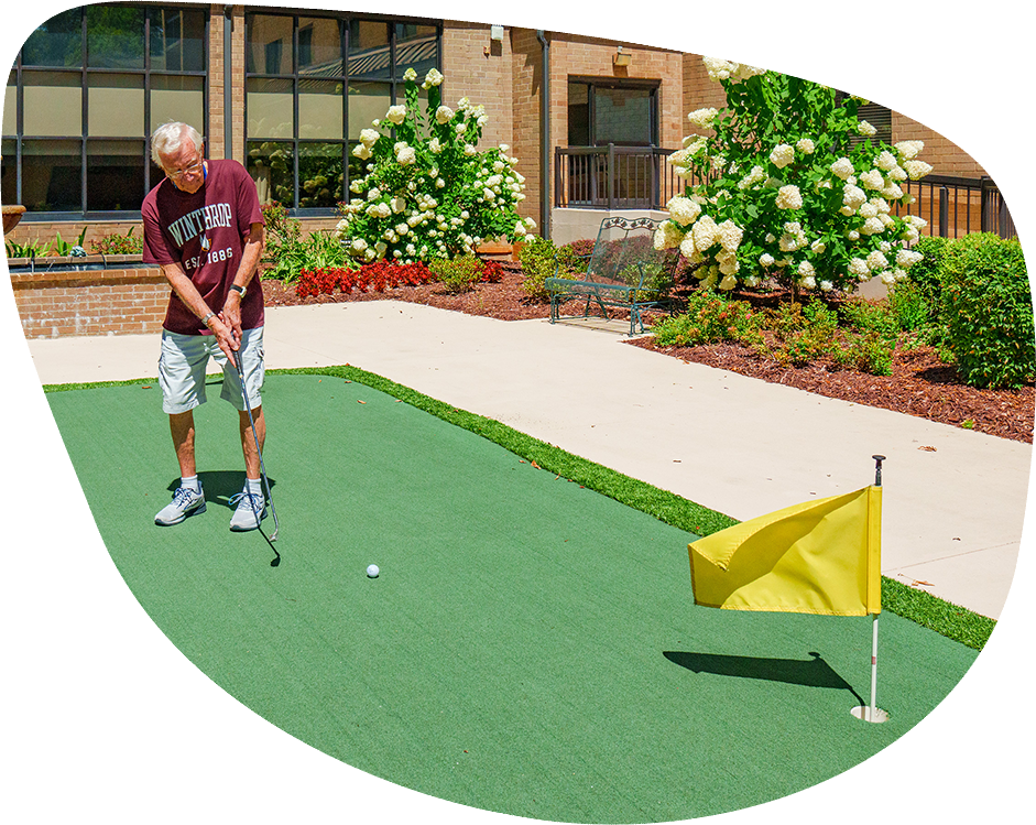 Resident enjoying golfing on the facility grounds