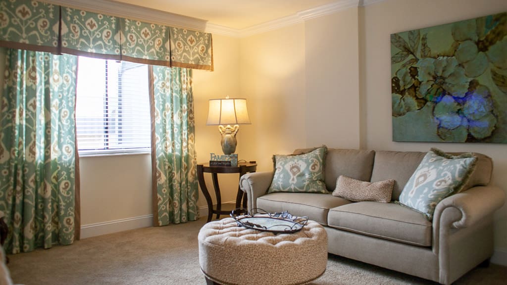 Cozy living room with decorative curtains and sofa