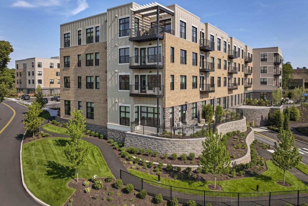 Exterior view of Waterstone on High Ridge building surrounded by landscaped gardens
