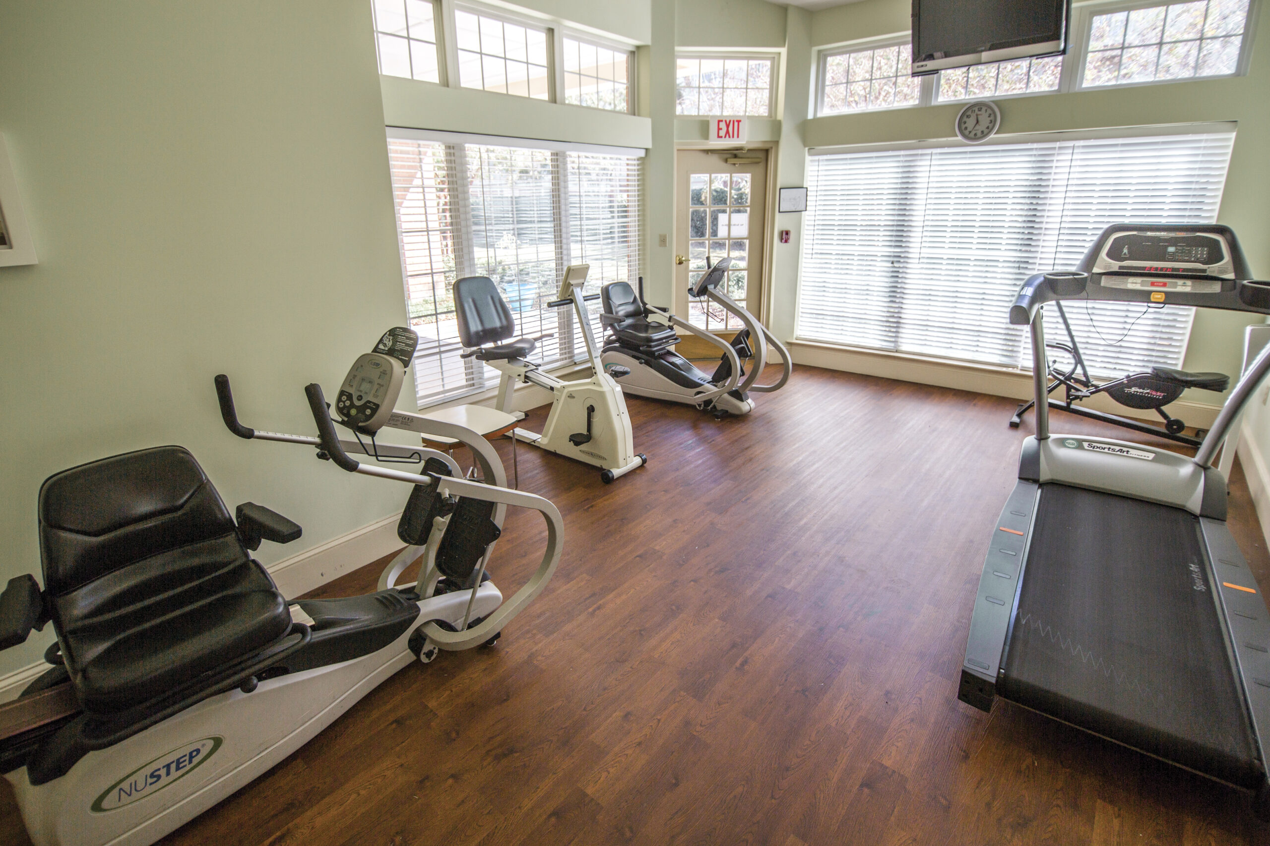 Well-equipped fitness room with exercise machines