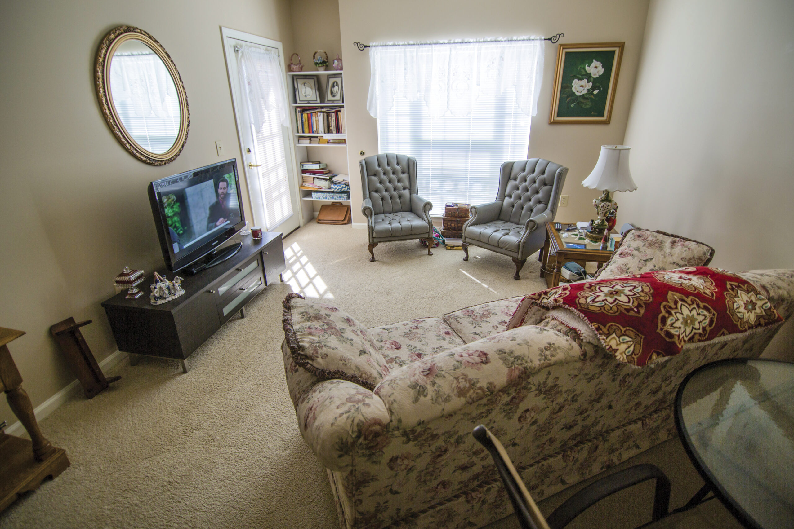 Cozy living room with armchairs and a TV