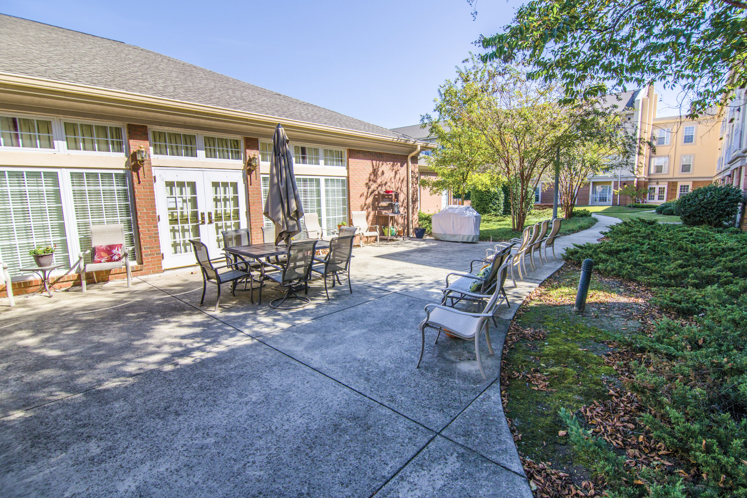 Outdoor seating area with tables and chairs