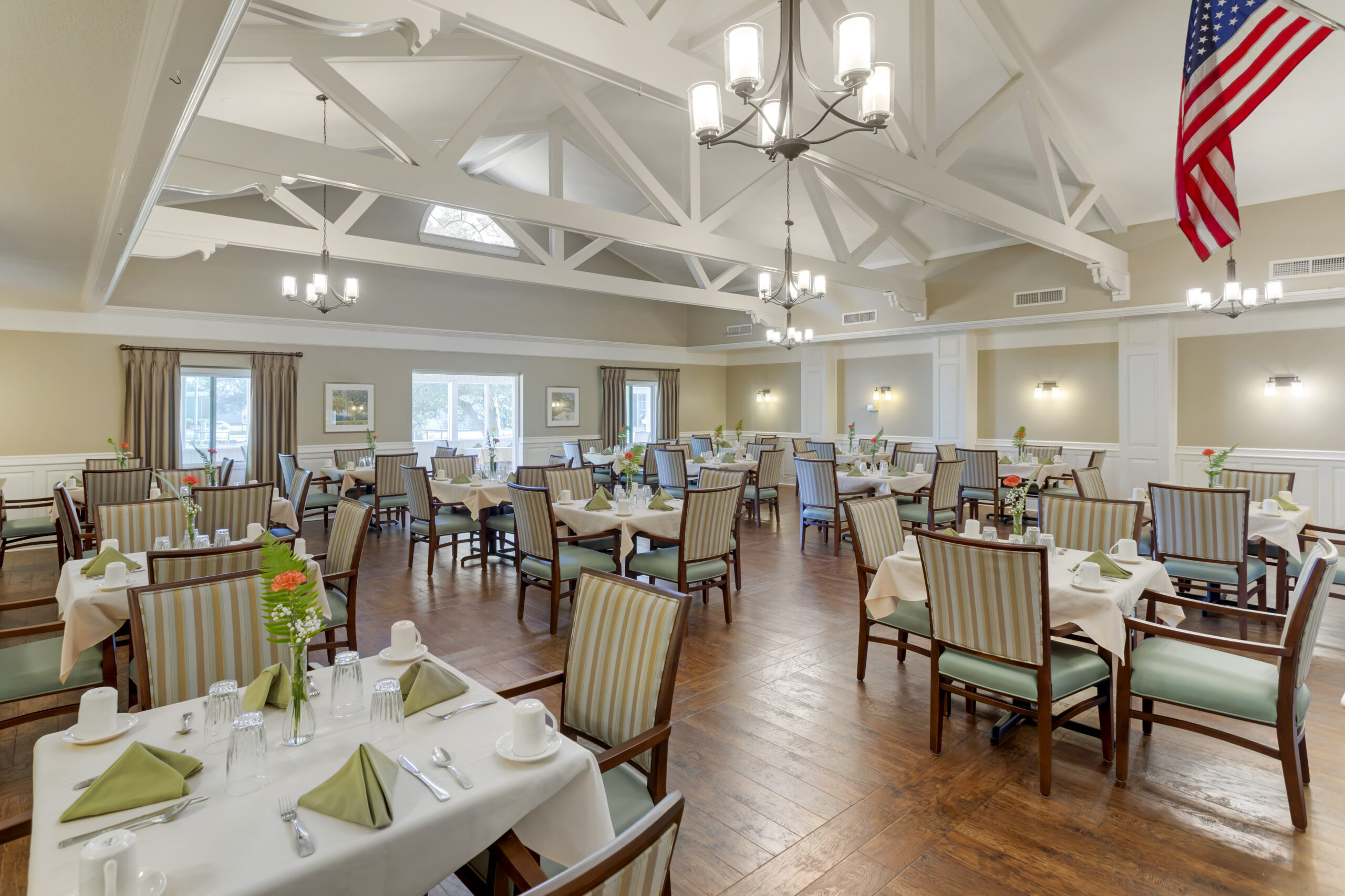 Bright dining room setup with tables and chairs