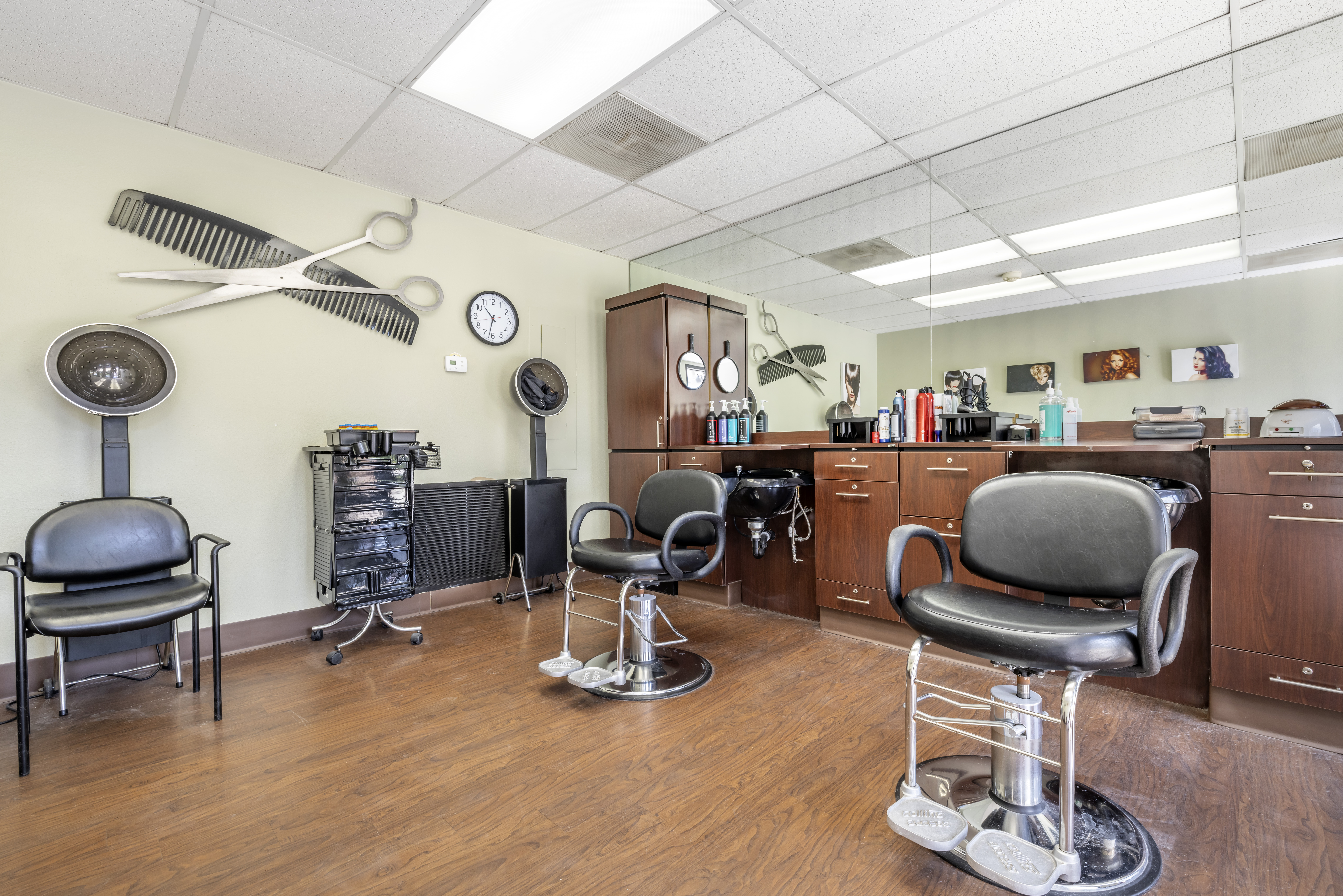 Interior of a hair salon with salon chairs and equipment