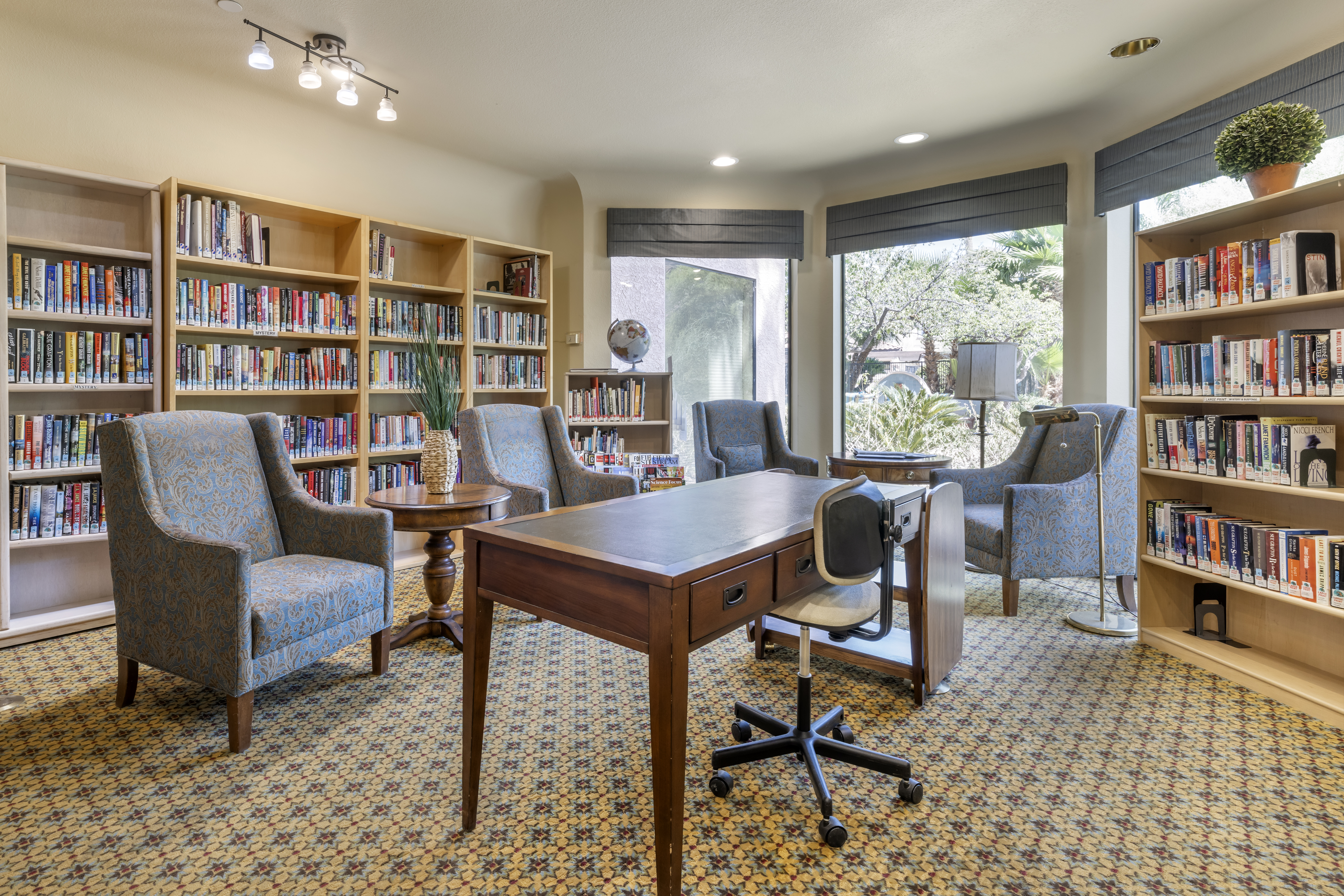 Bright reading room with bookshelves and comfortable seating