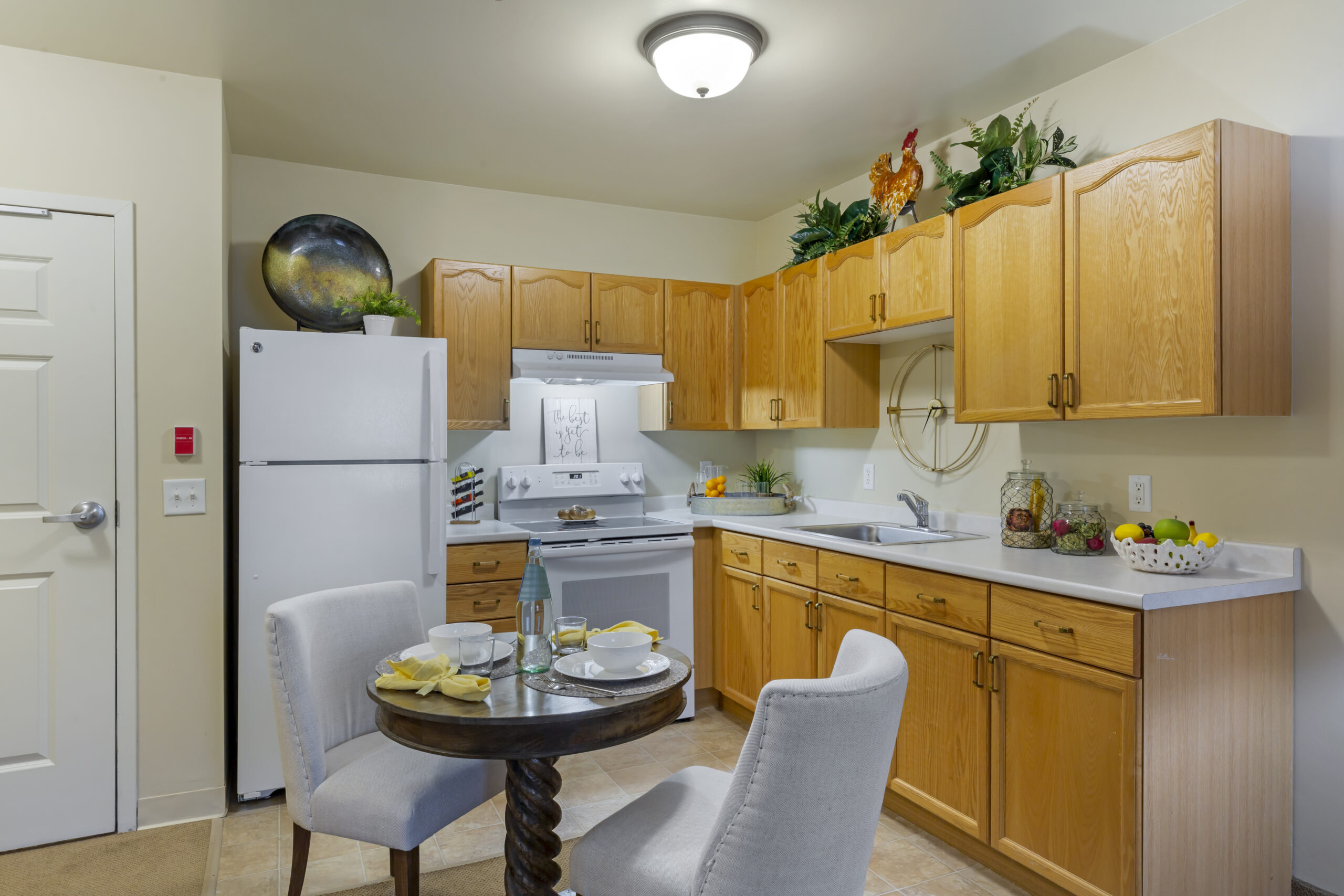 Cozy kitchen area with wooden cabinets and dining table