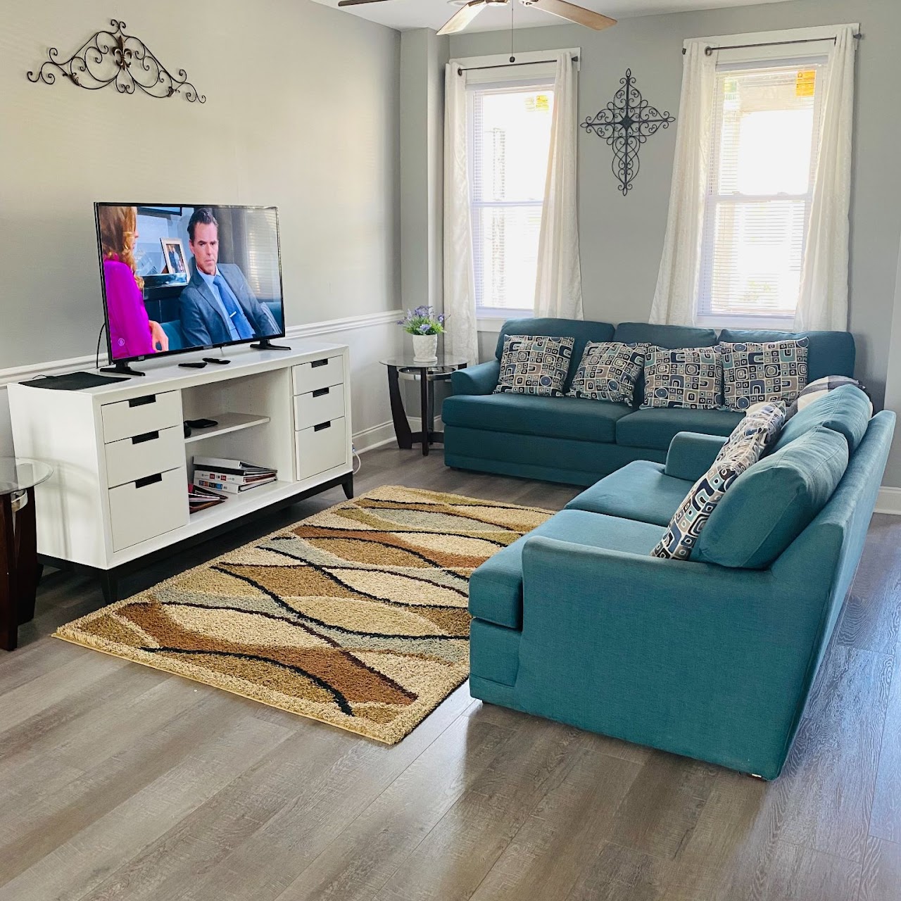 Bright common area with comfortable seating and TV