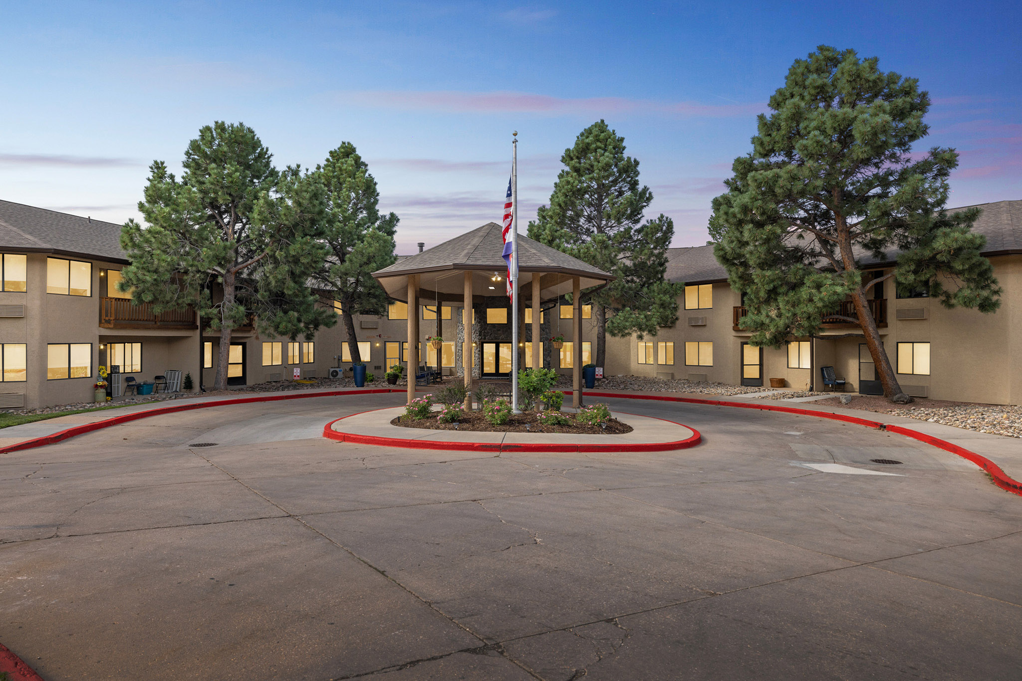 Exterior view of the facility courtyard with trees