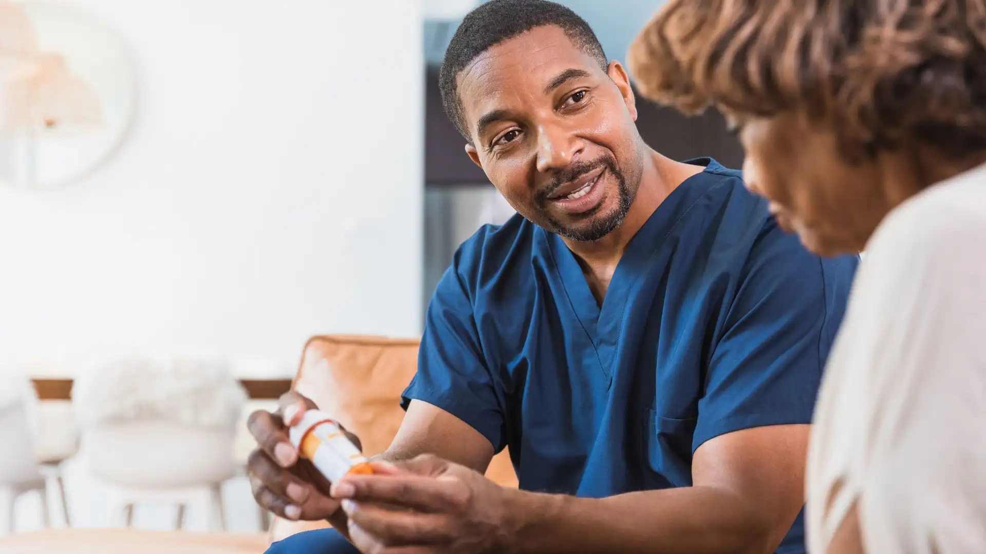 Healthcare professional assisting senior woman
