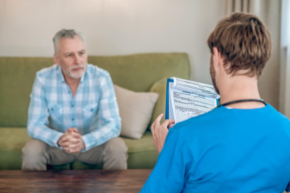 Healthcare professional consulting with a senior resident