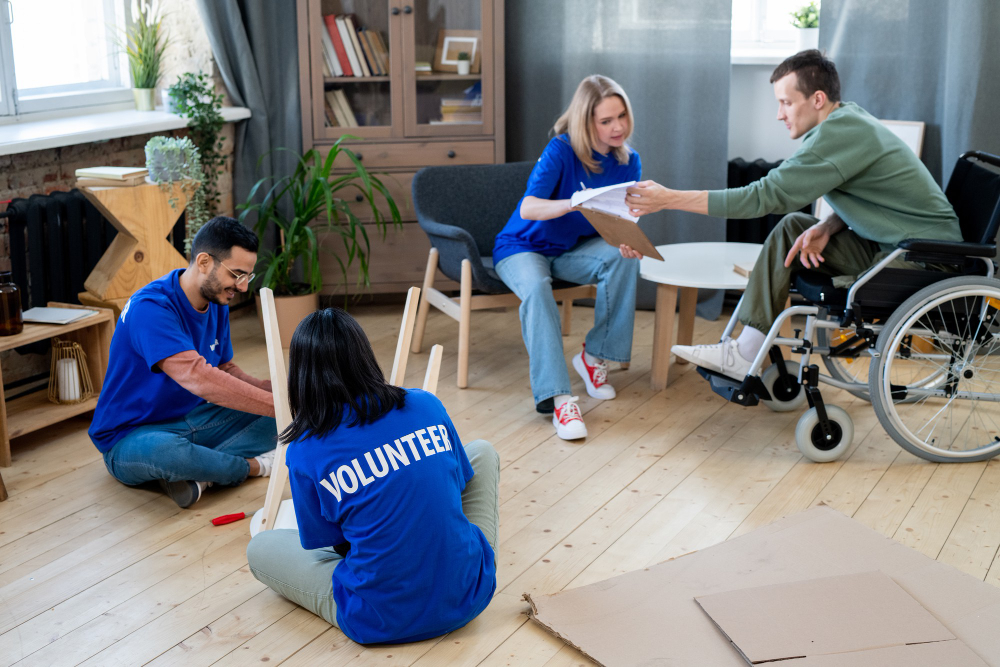 Volunteers assisting residents in an activity