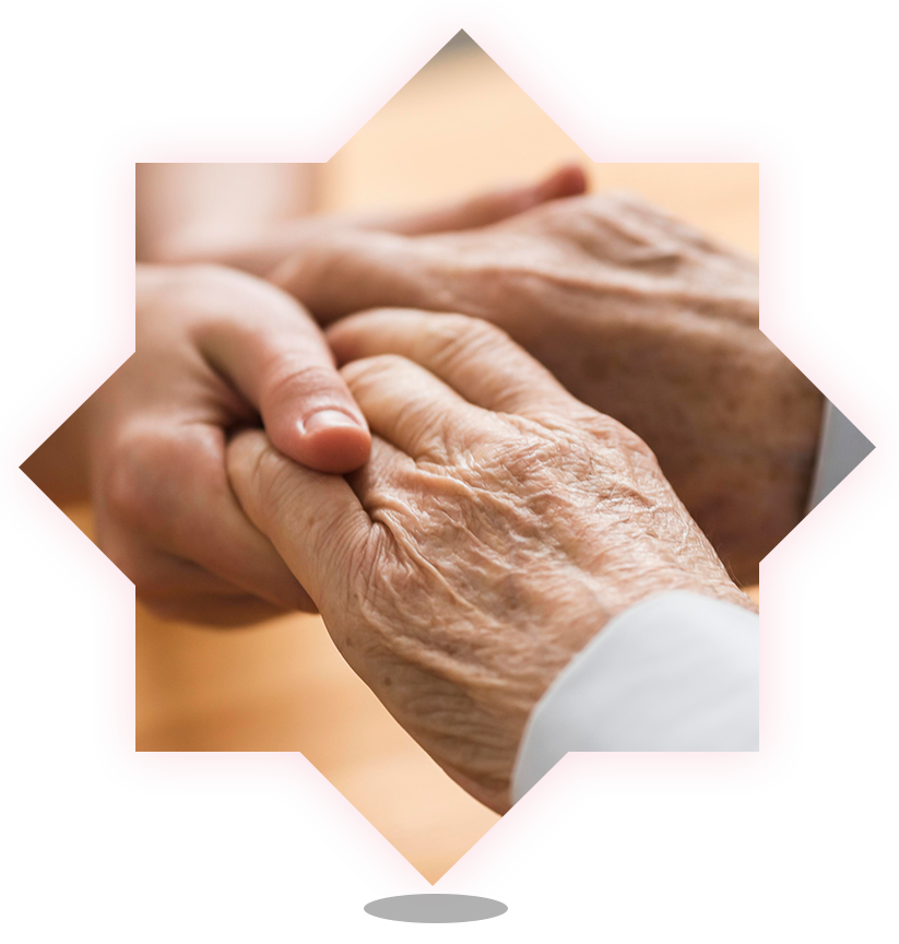 Close-up of intertwined hands representing care