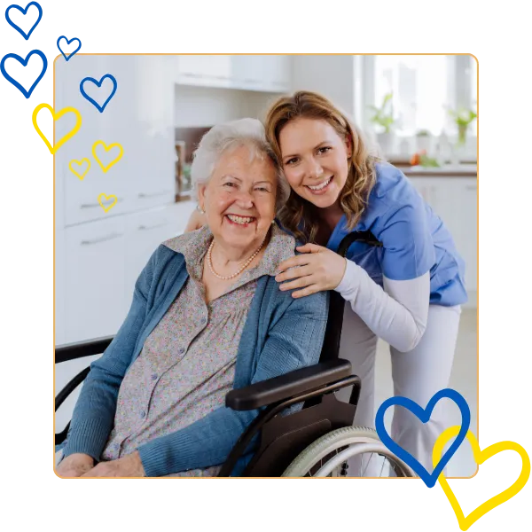 Senior resident smiling with caregiver