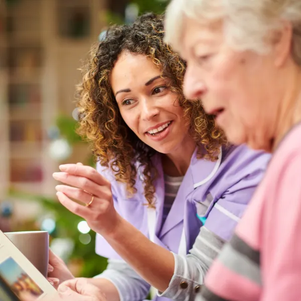 Caregiver engaging with an older adult.