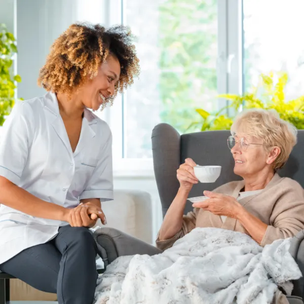 Caregiver interacting with a senior resident