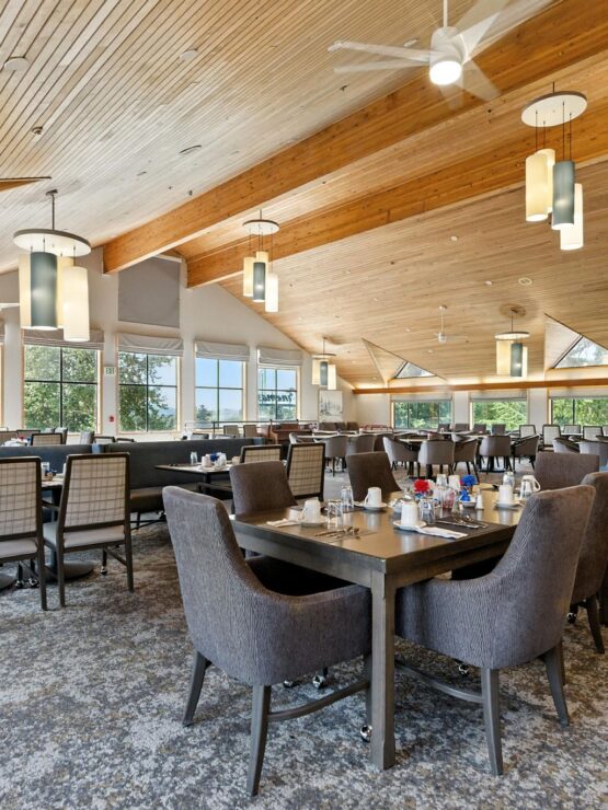 Bright and spacious dining area with tables and chairs