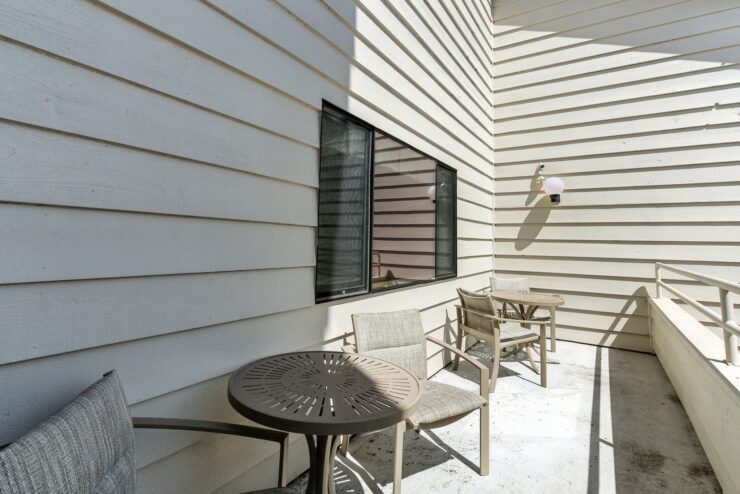 Outdoor seating area with tables and chairs.