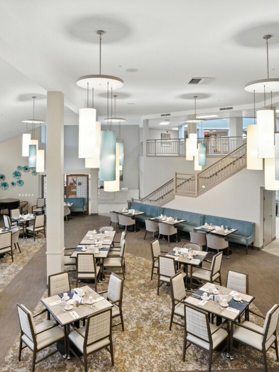 Dining area with set tables and modern decor.