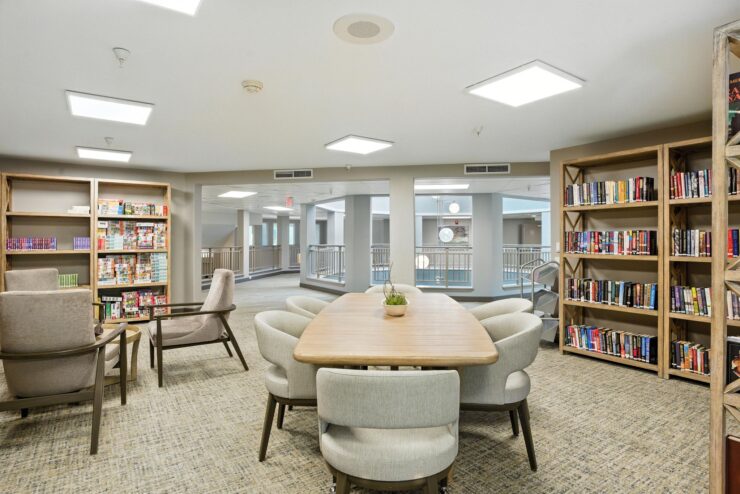 Interior view of a common reading area with bookshelves.