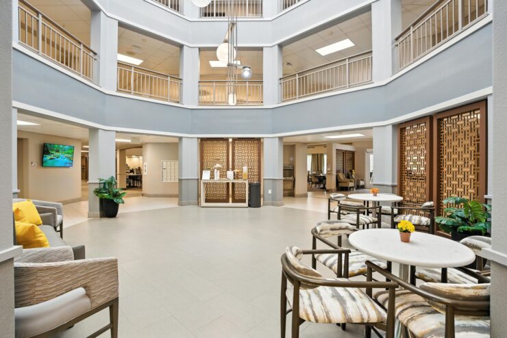 Bright common area with seating and decor.