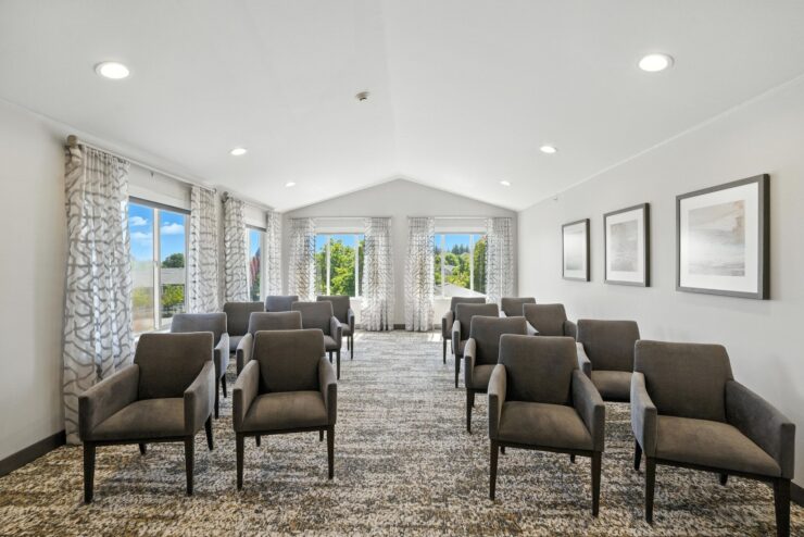 Interior common area with chairs and windows.