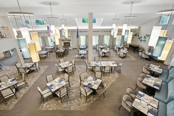 Spacious dining room with tables set for meals.