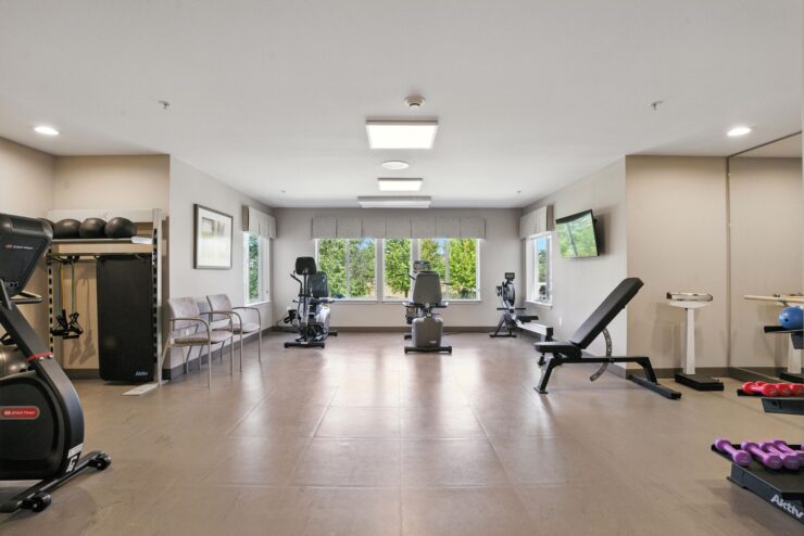 Fitness area with equipment and natural light