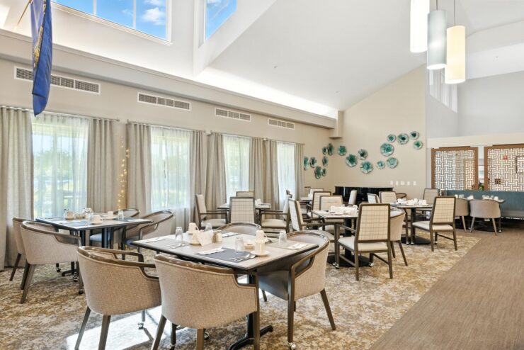 Elegant dining room with tables set for meals.