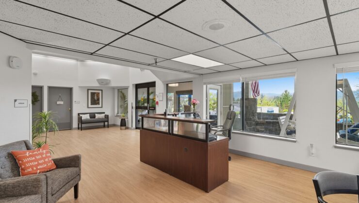 Bright reception area with sunlight and seating