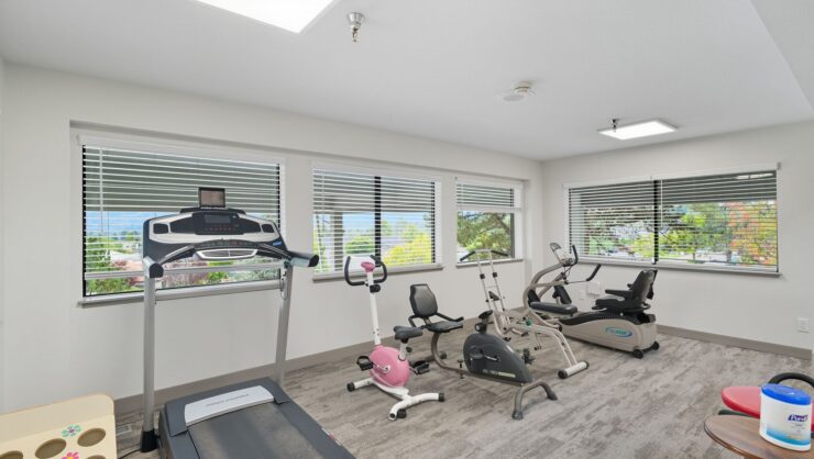 Well-equipped exercise room with various equipment
