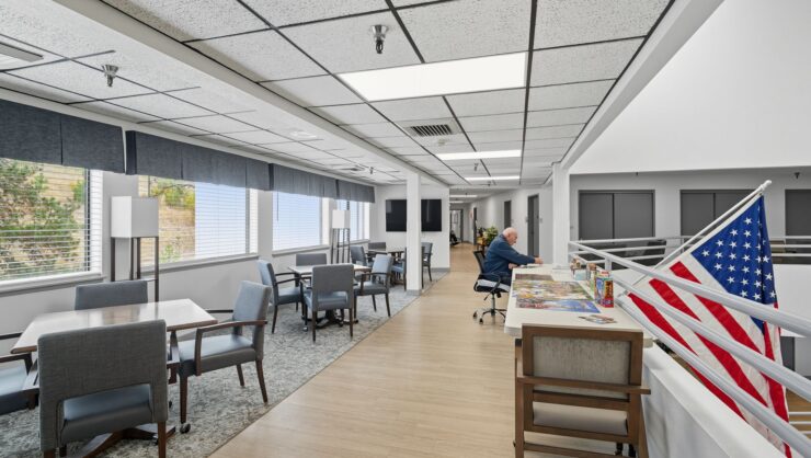Common area with a resident and an American flag.