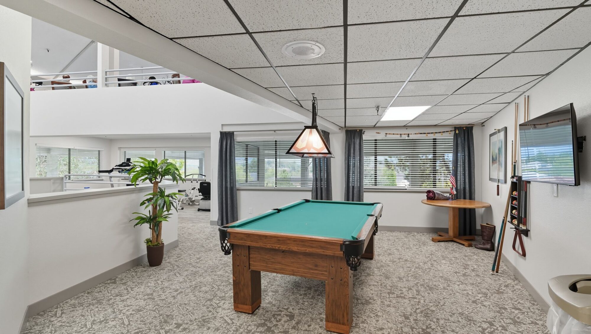 Interior view of a recreational area with a pool table.