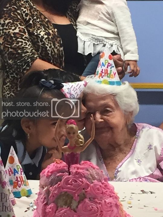 Celebration with a resident and children at a birthday party.