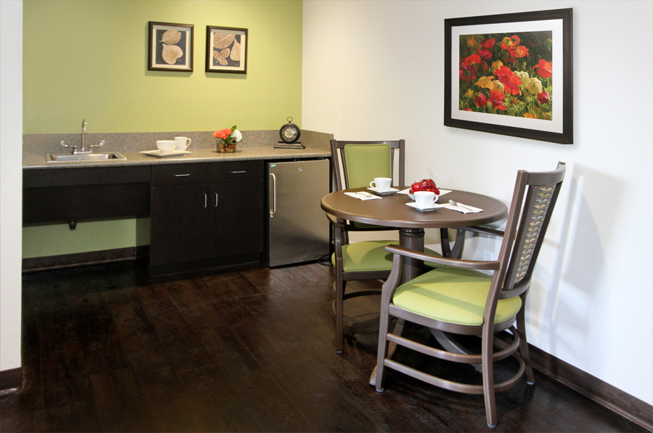 Cozy kitchenette area with a table and chairs