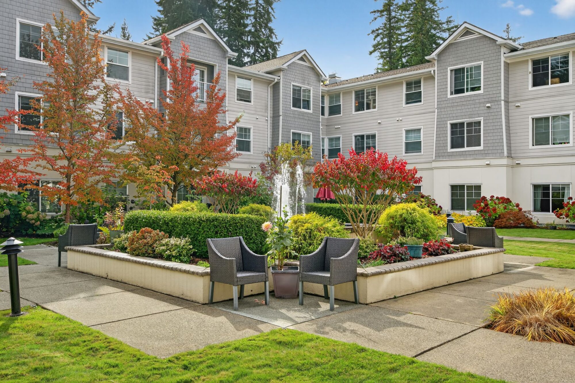 Lush outdoor garden with seating and fountain
