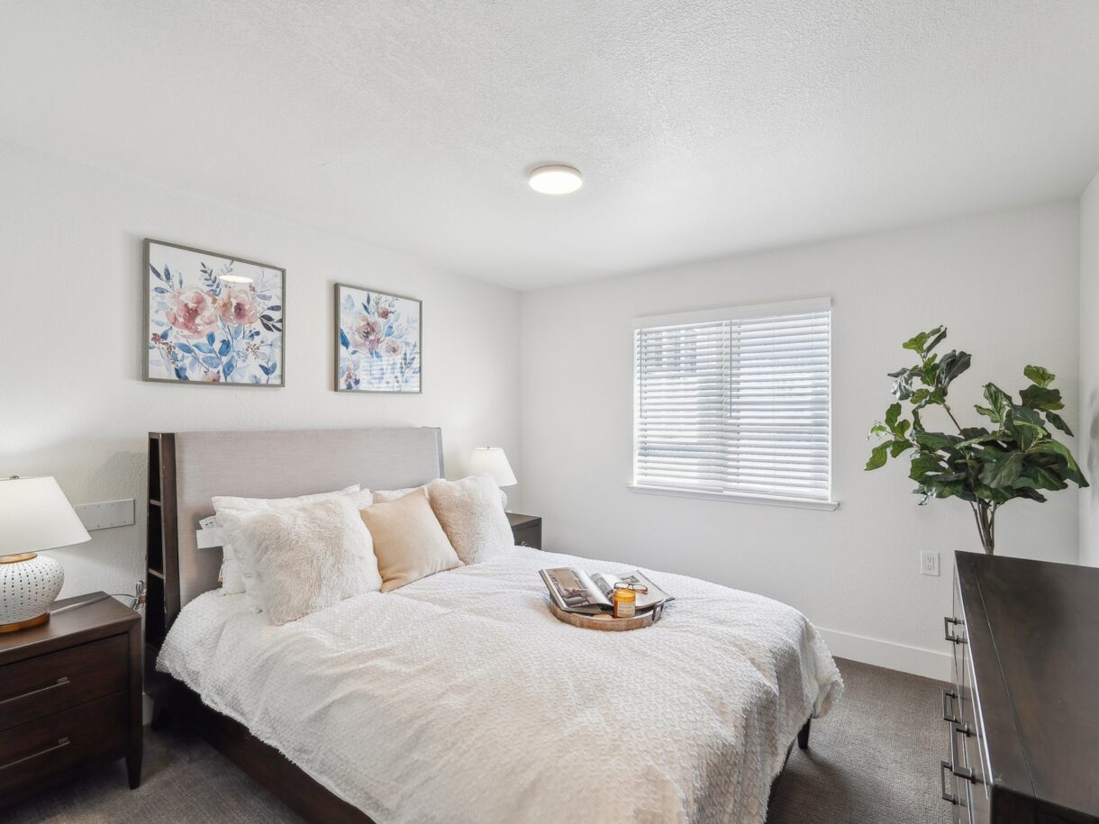 Cozy bedroom with floral decor and a bed
