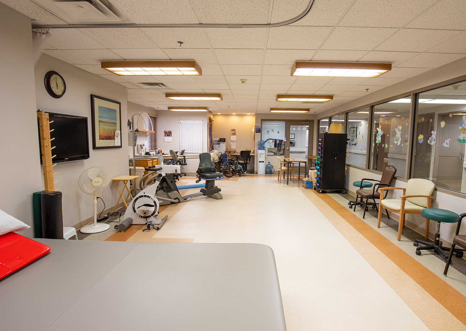 Physical therapy room with exercise equipment