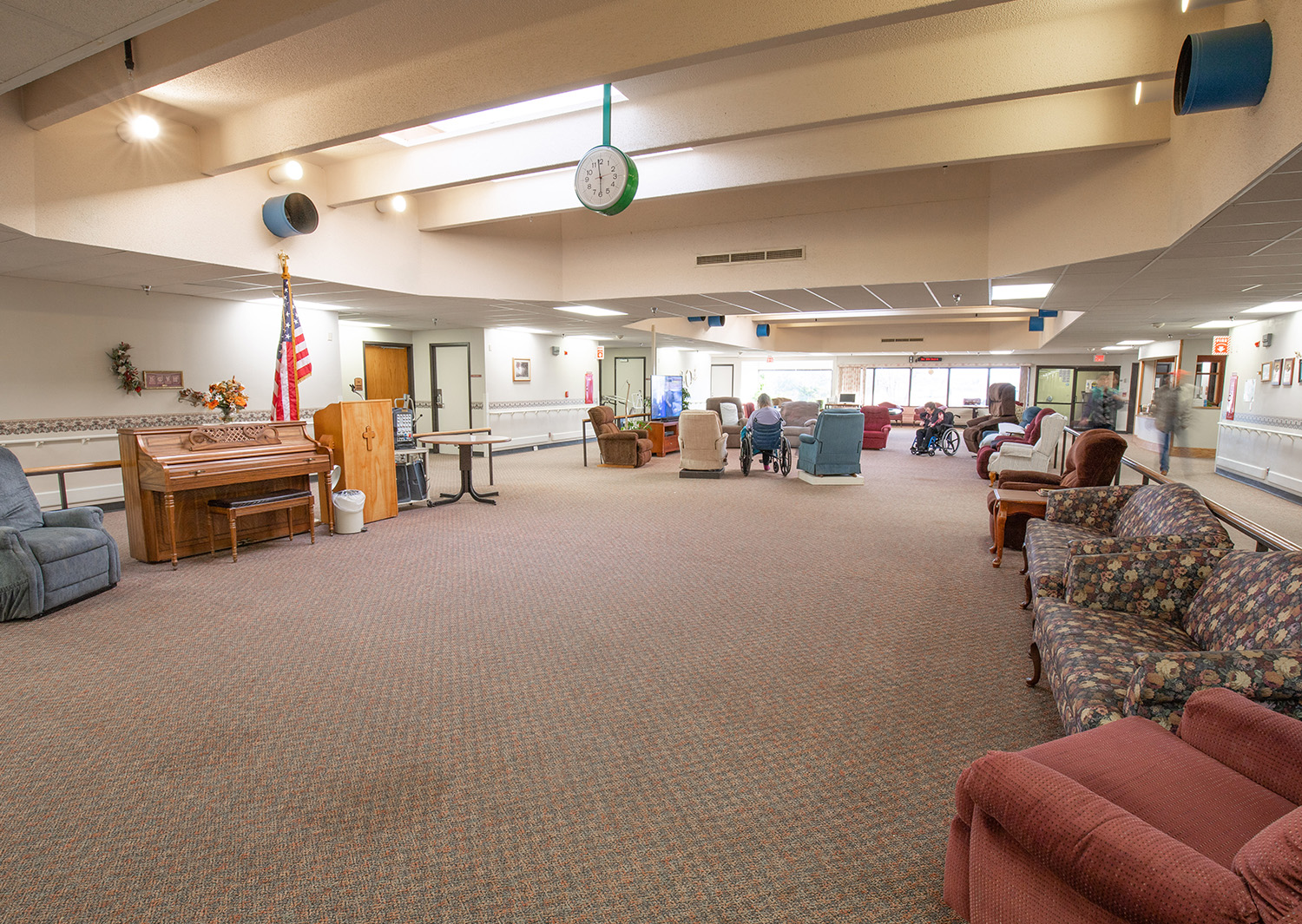 Interior common area with seating and residents