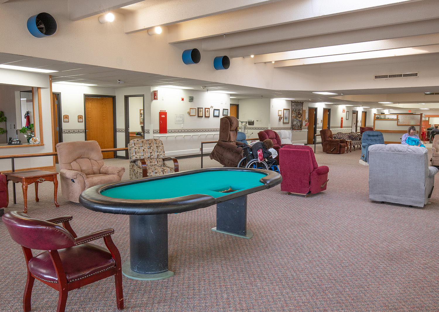 Common area with comfortable seating and residents