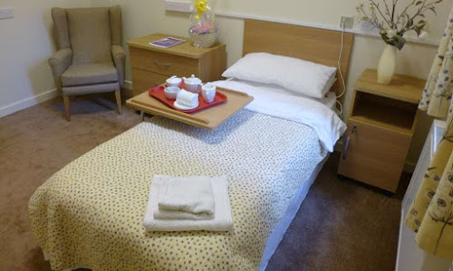 Cozy resident room with a bed and refreshments