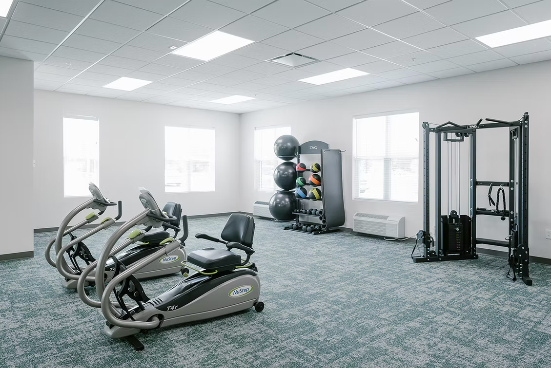 Well-equipped fitness room with exercise machines
