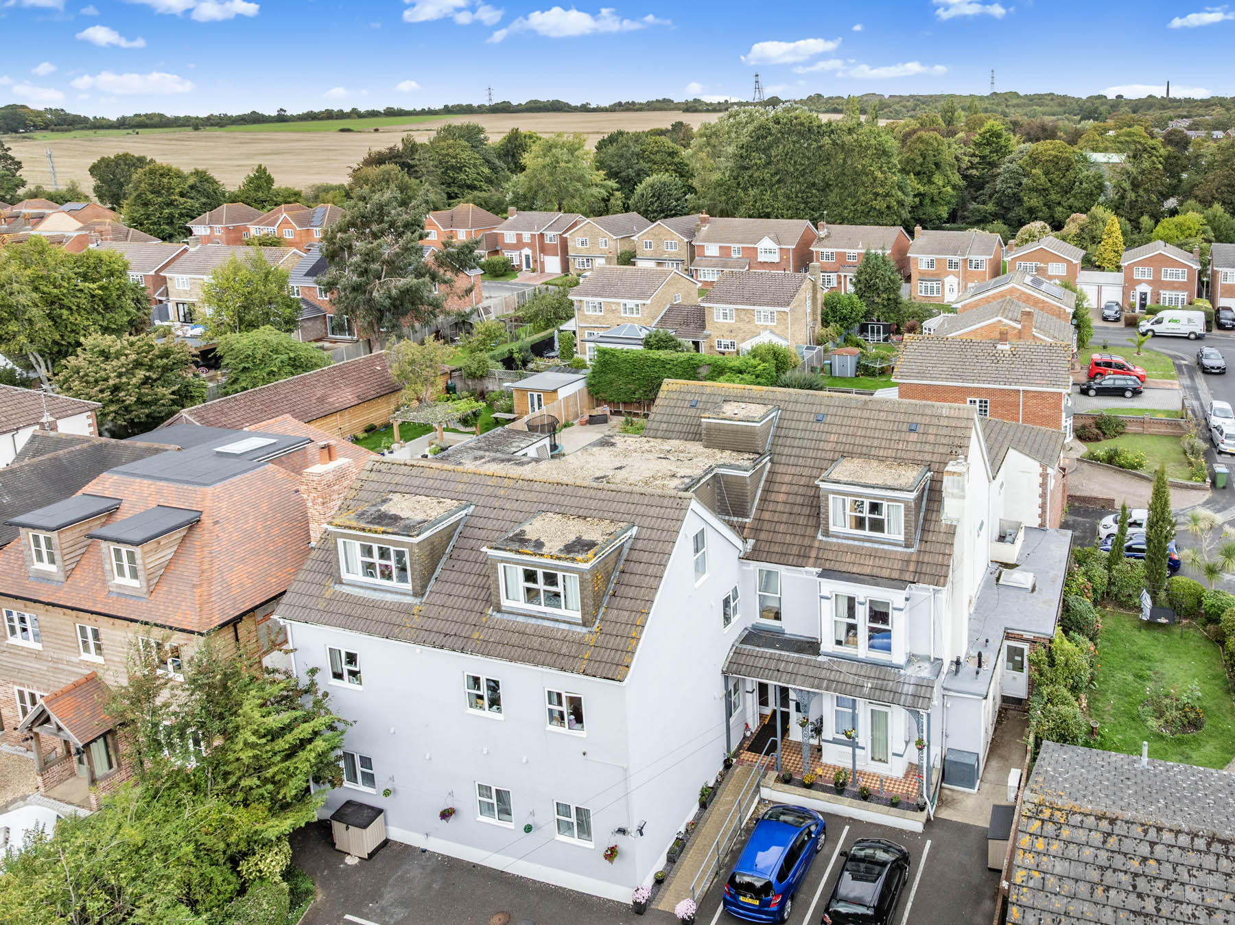 Aerial view of the residential facility and surrounding homes