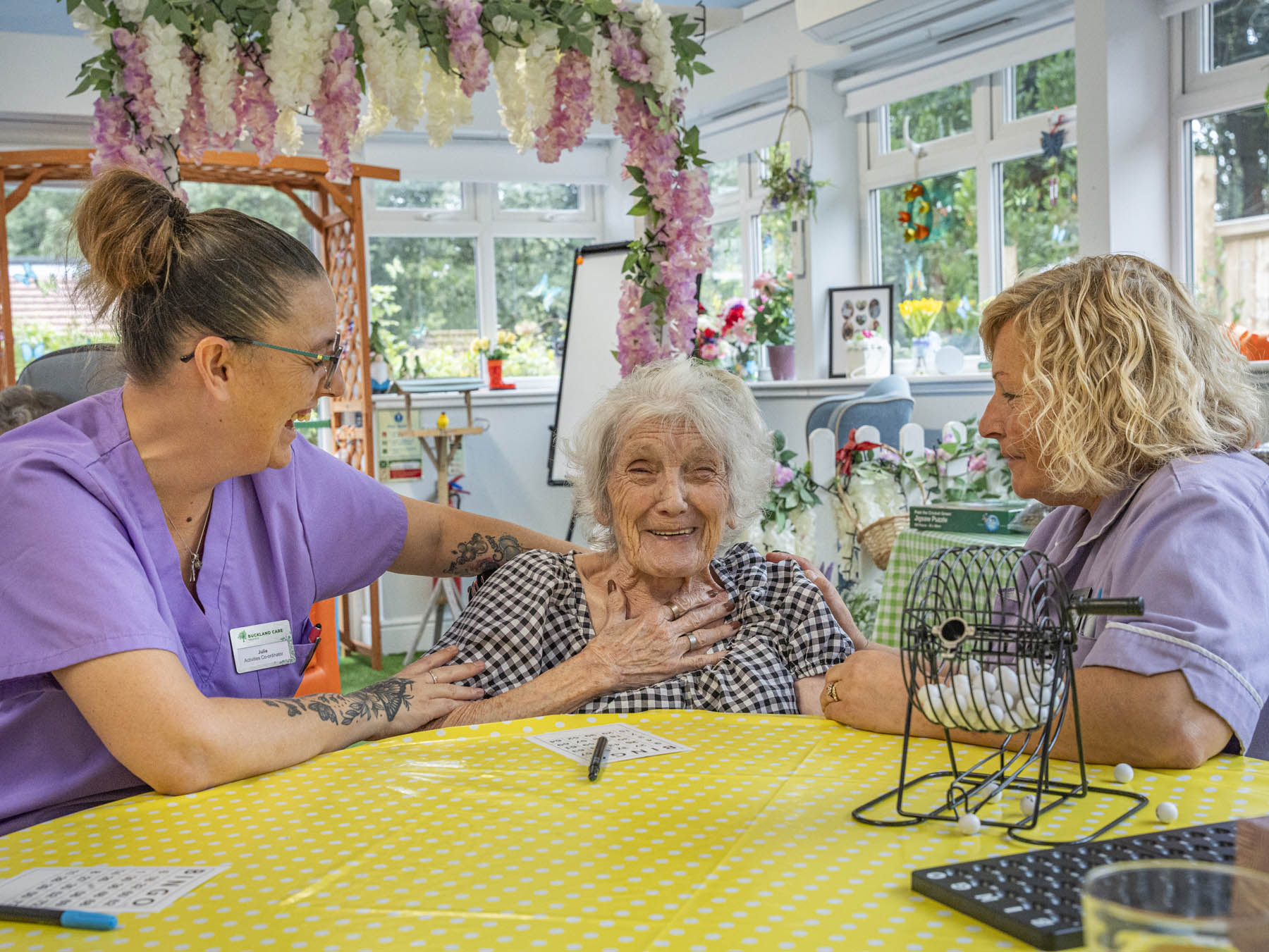 Residents and staff enjoying an activity in a common area