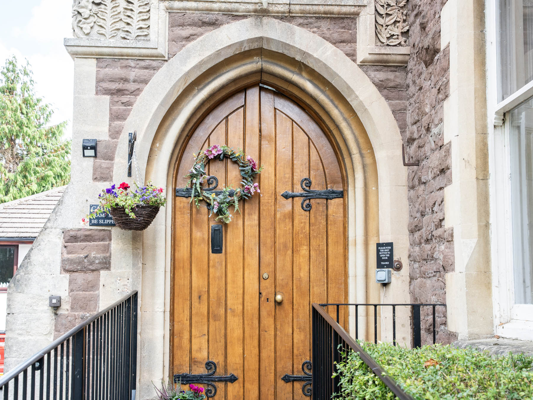 Entrance door with greenery and floral decorations