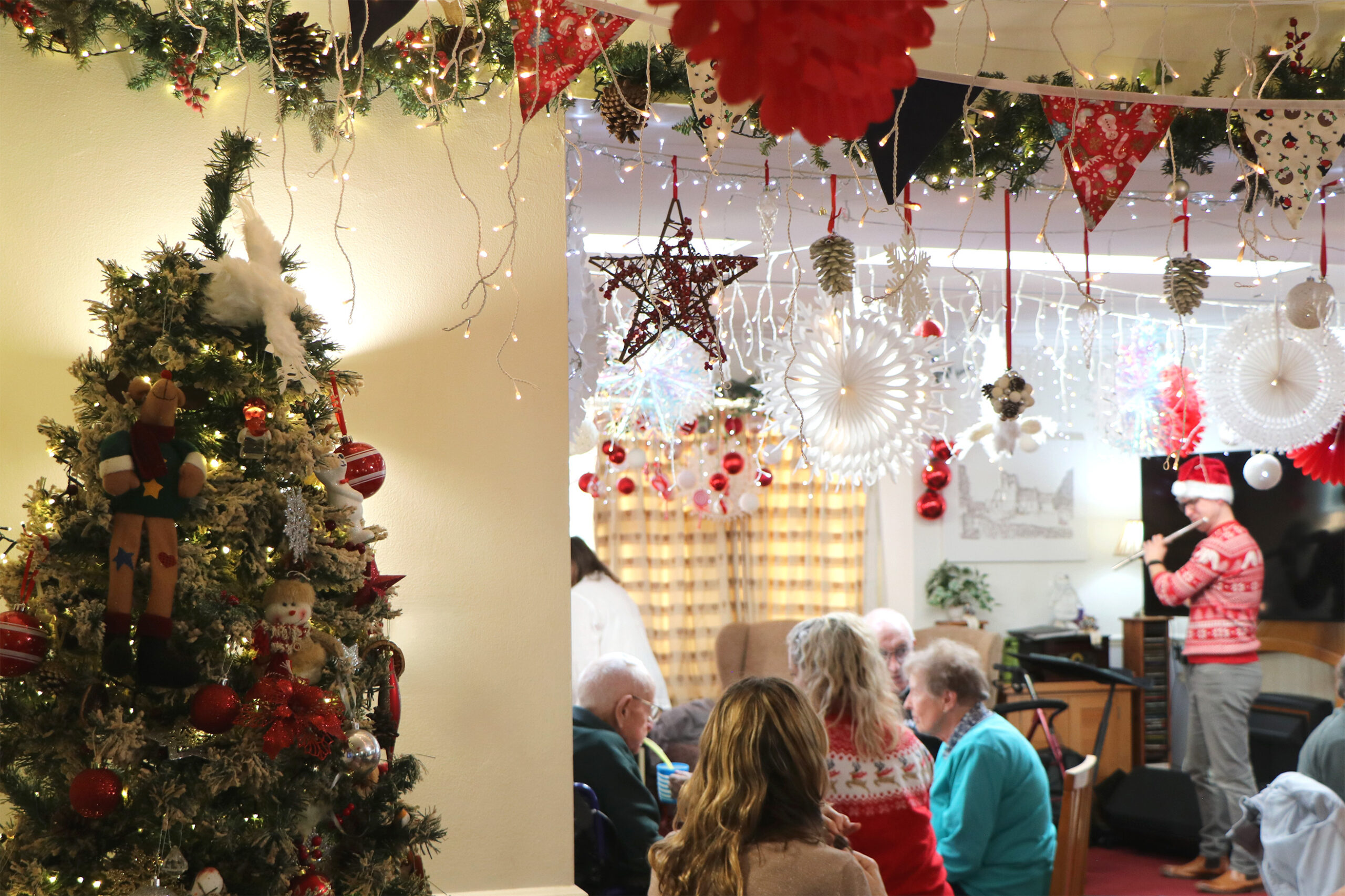 Residents enjoying a festive gathering with decorations