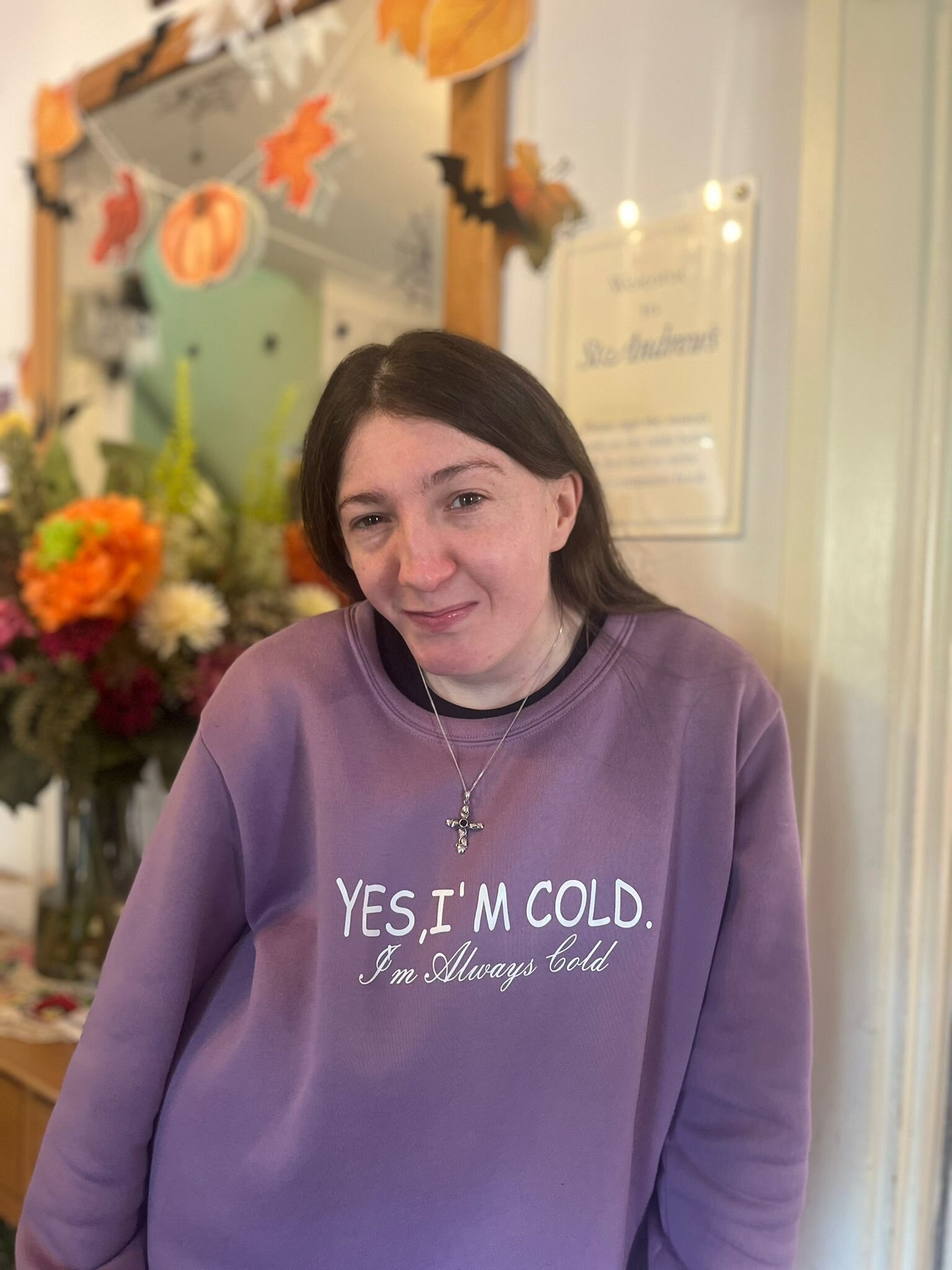 Resident in a cozy interior with seasonal decorations
