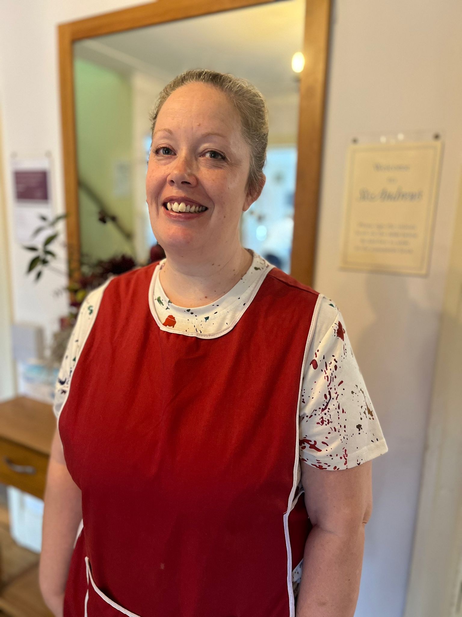 Staff member smiling in a residential care home