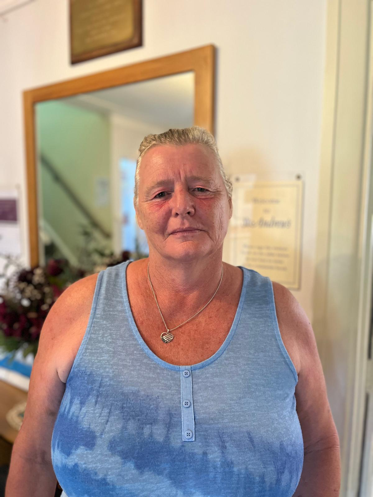 Staff member in a common area welcoming visitors