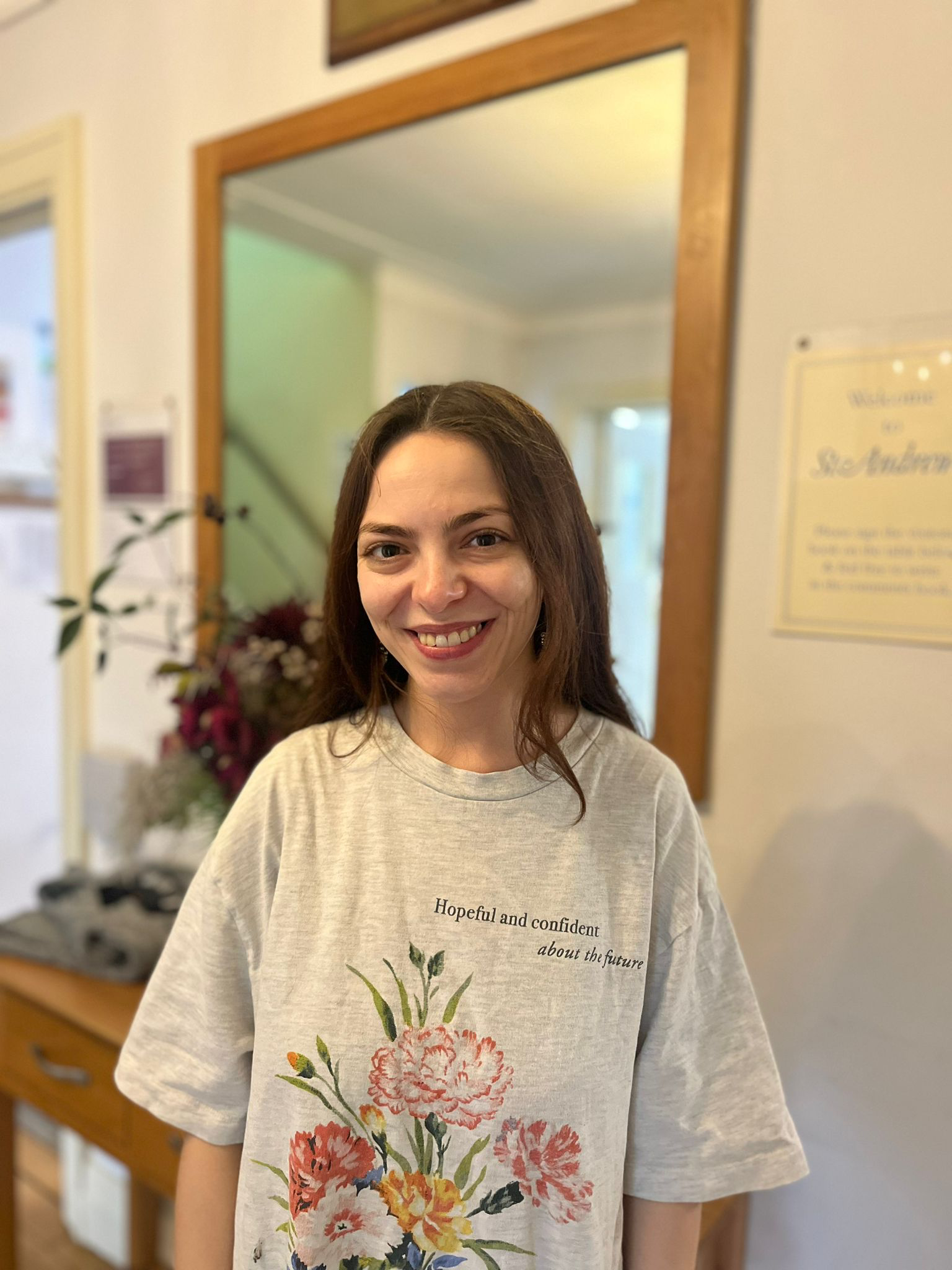 Staff member smiling in a facility interior