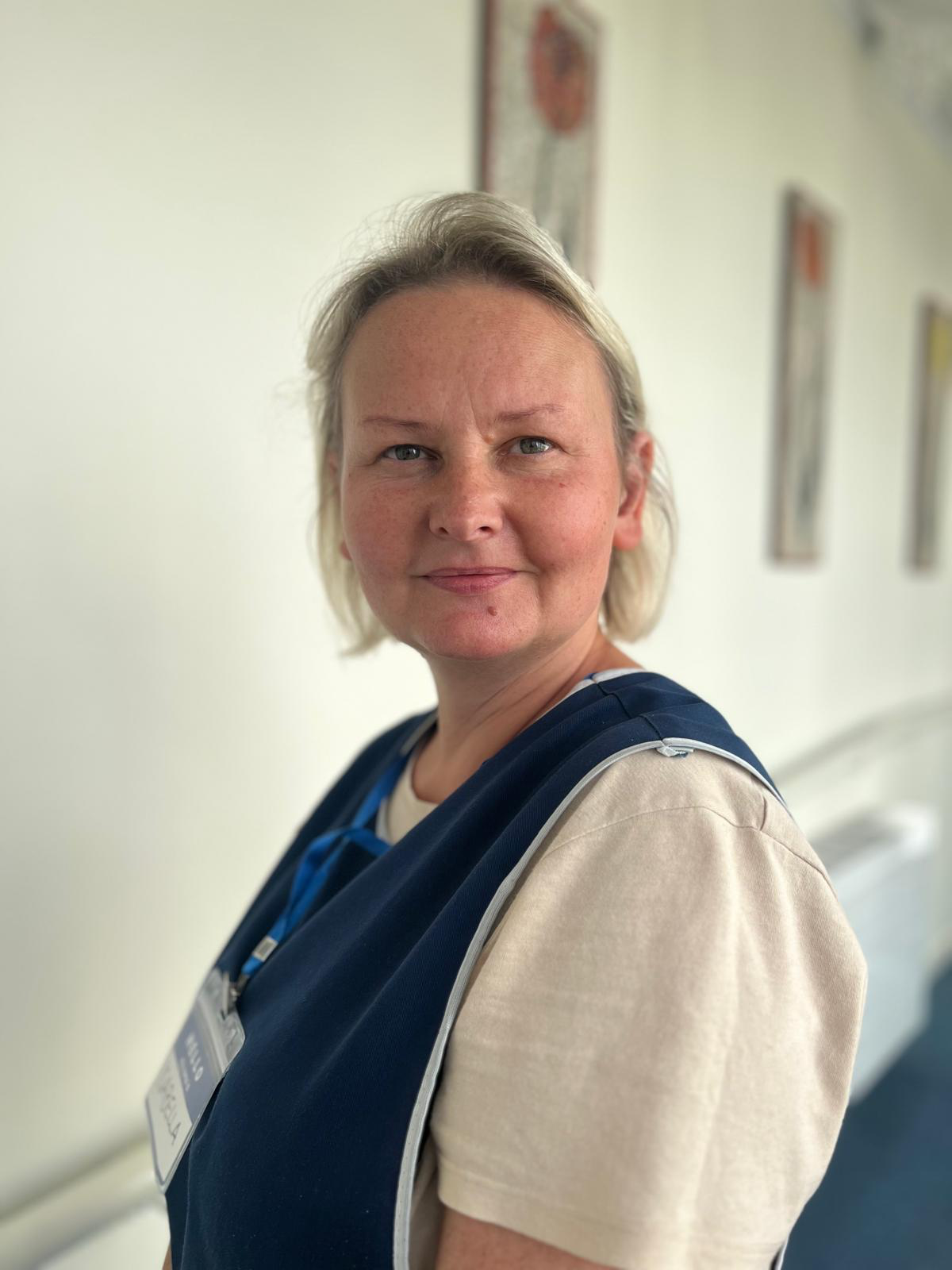 Staff member in a facility corridor